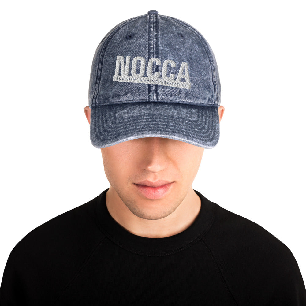 Vintage cotton twill cap with embroidered NOCCA logo in white